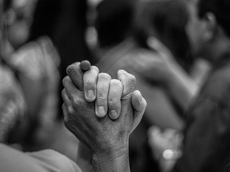 Hands joined together in prayer and unity
